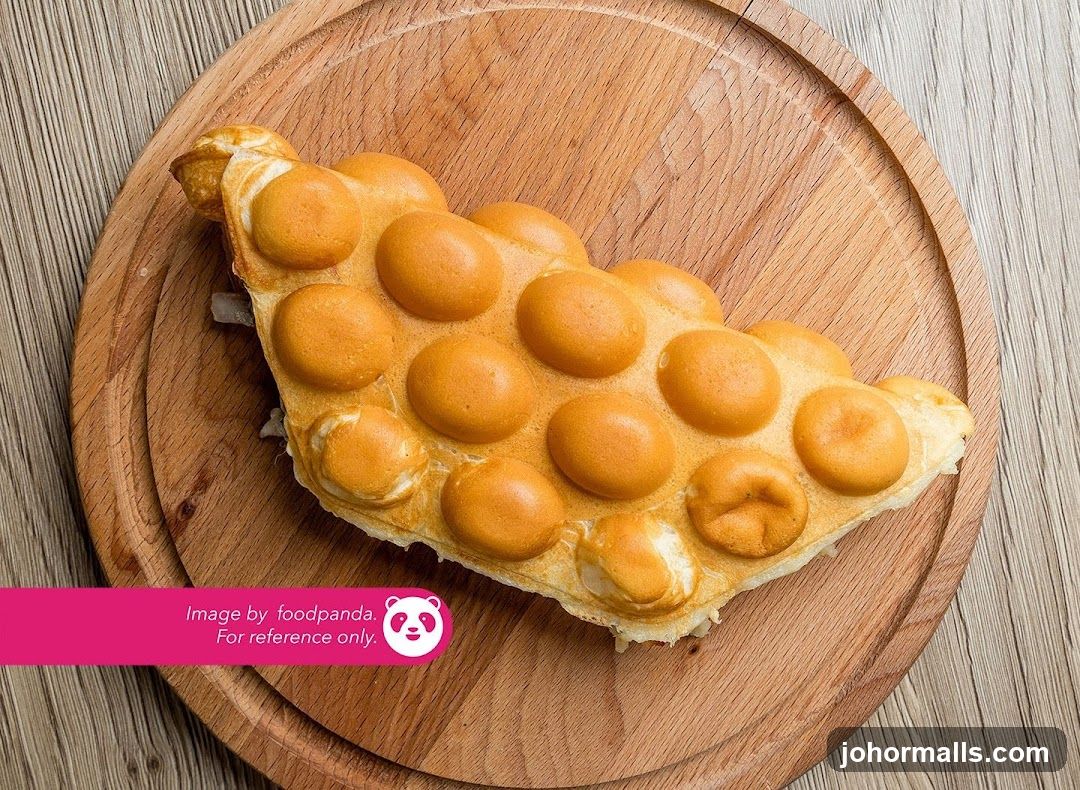 Egg-shaped waffle on wooden plate