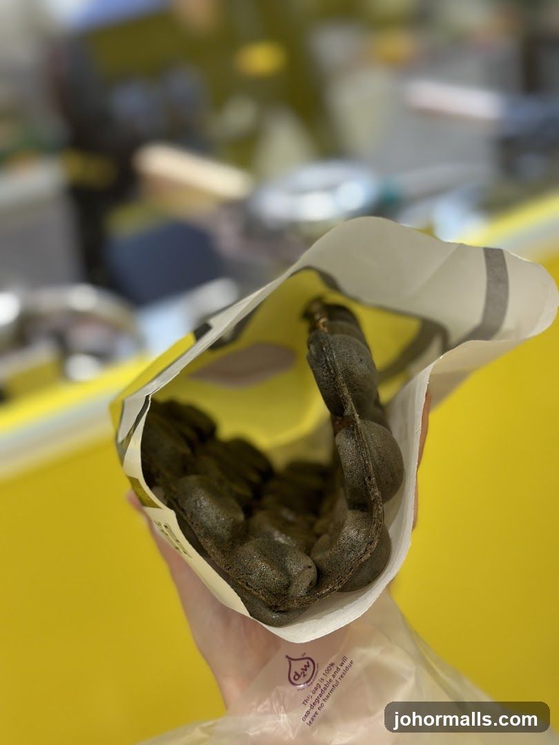 Hand holding packaged food item