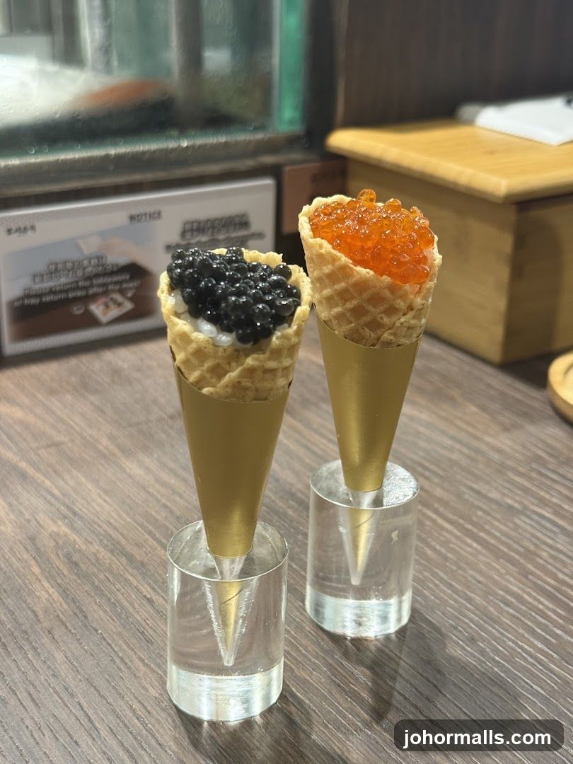 Two caviar-filled waffle cones on display
