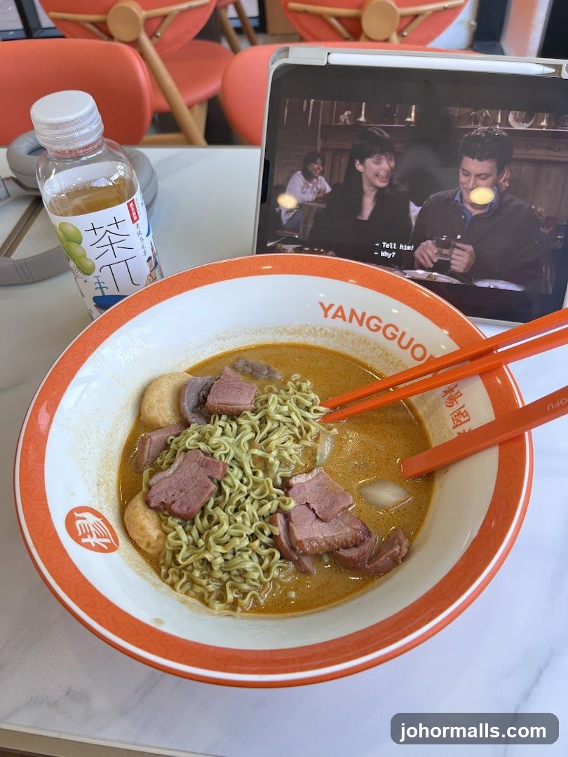 Ramen meal with tablet and beverage