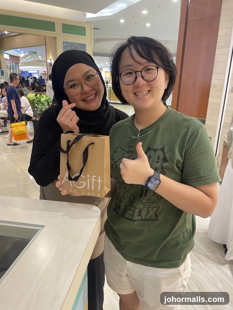 Two individuals posing in a shopping mall