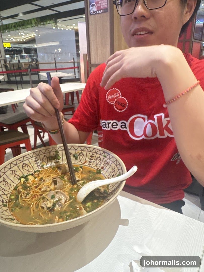 Person eating noodles