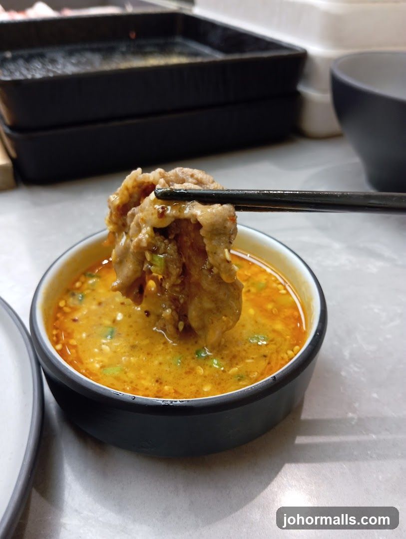Dipping Meat in Sauce