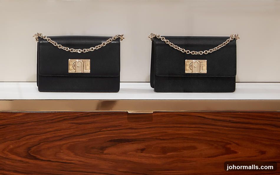 Two Black Handbags on Display