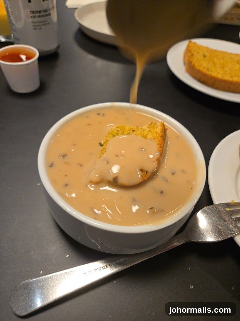 Soup being poured into a bowl