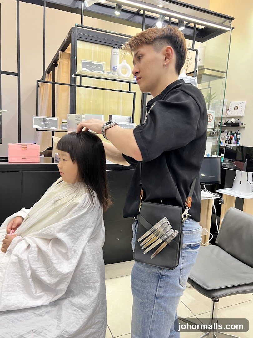 Hairdresser cutting a child's hair