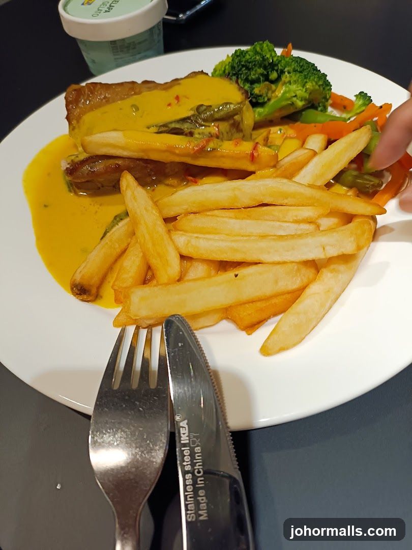 Chicken dish with fries and vegetables