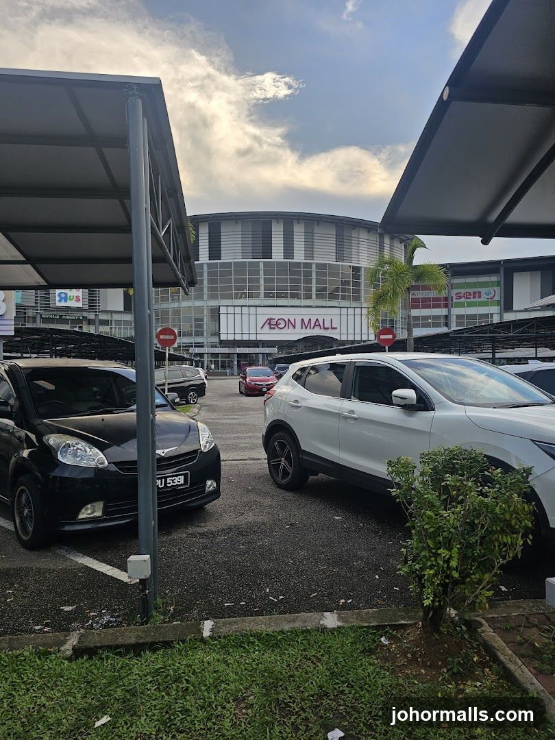 Parking lot with mall in background