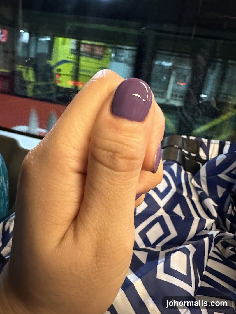 Hand with Purple Nail Polish