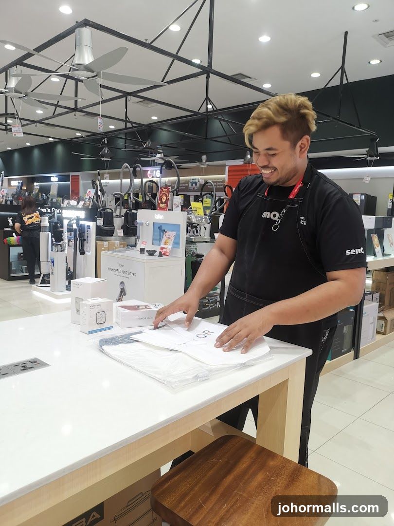 Sales associate arranging items on a counter