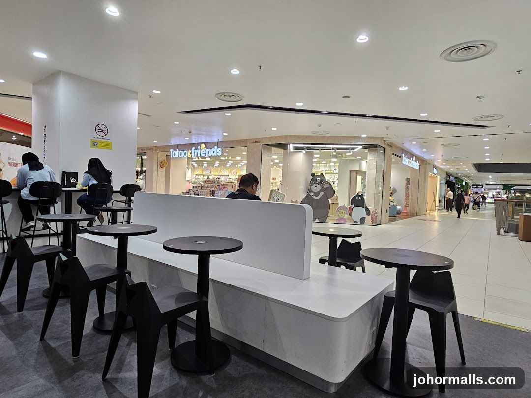 Mall Interior with Shops and Seating Area