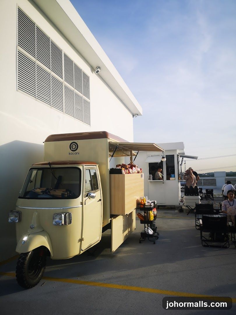 Outdoor cafe with a tuk-tuk serving food