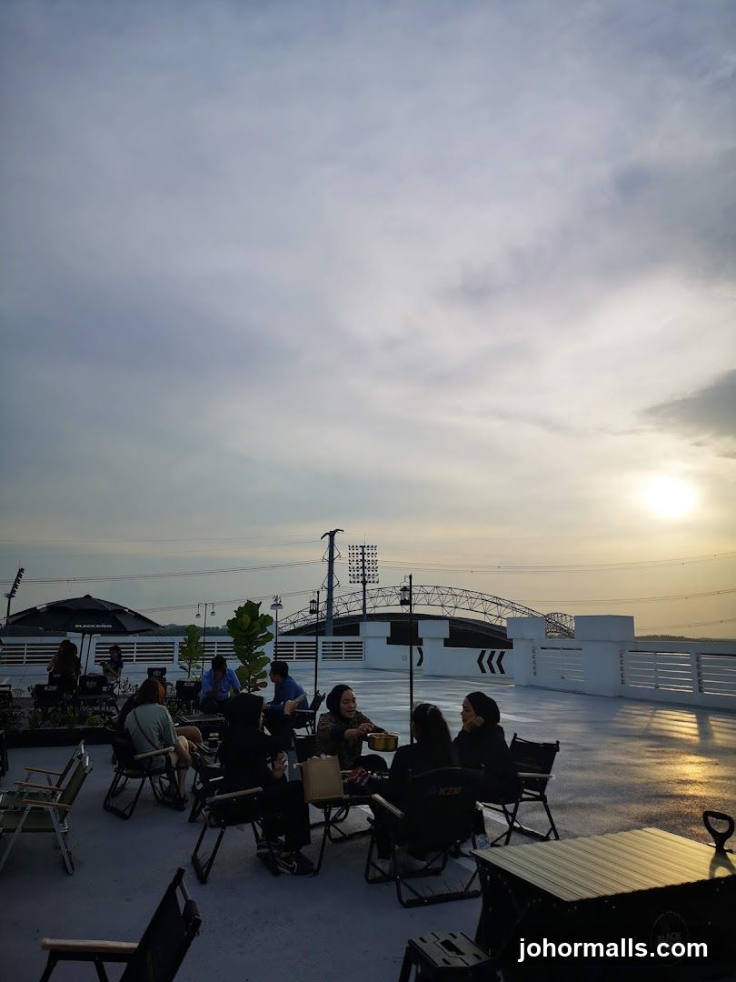 Rooftop gathering at sunset