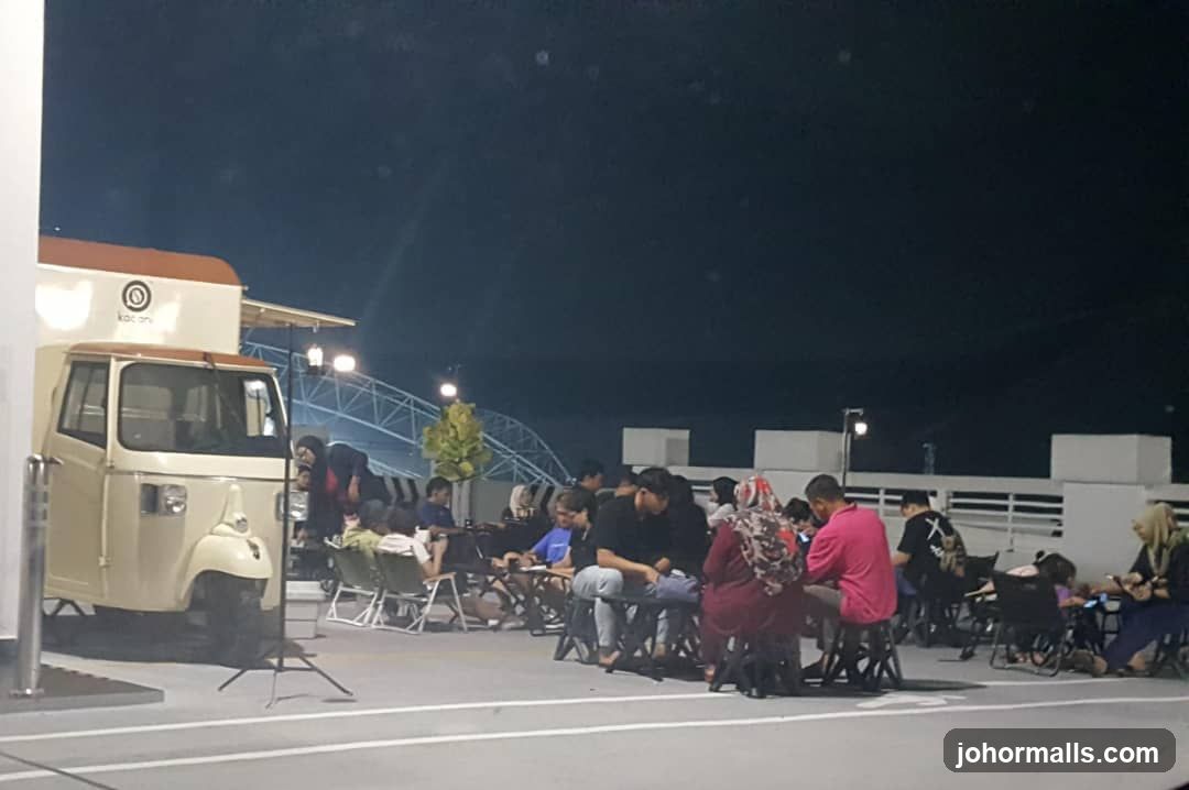 Outdoor seating area with food truck