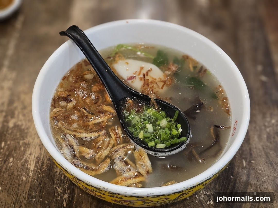 Bowl of Soup with Spoon