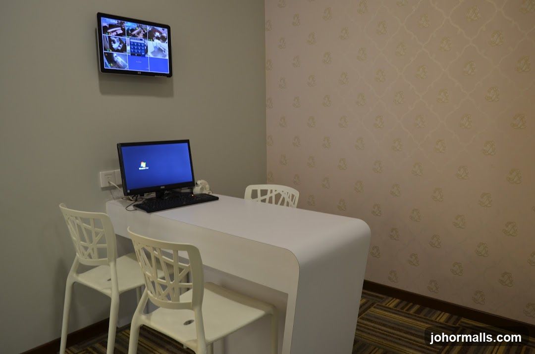 Reception desk with computer and security monitors