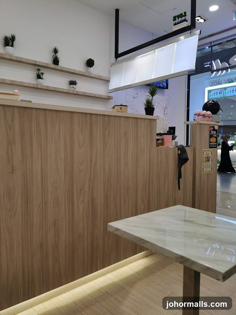Interior of a cafe with wooden counter and marble table