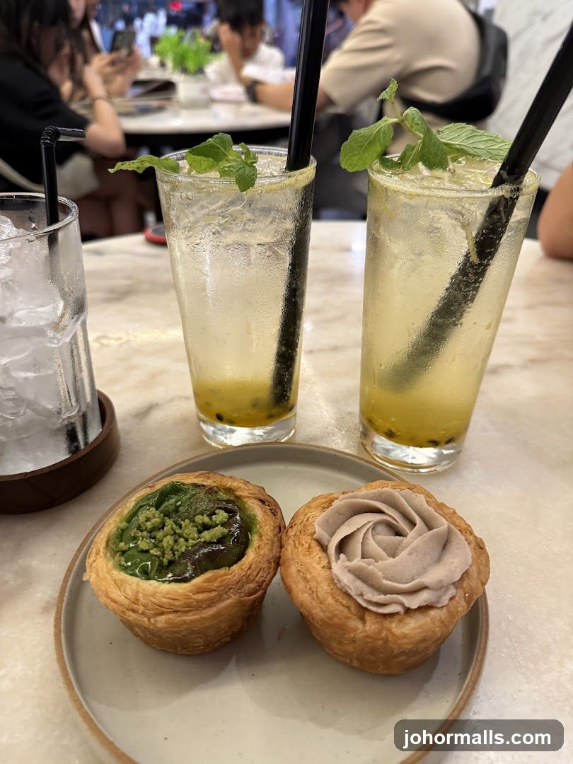 Two pastries and two drinks on a table