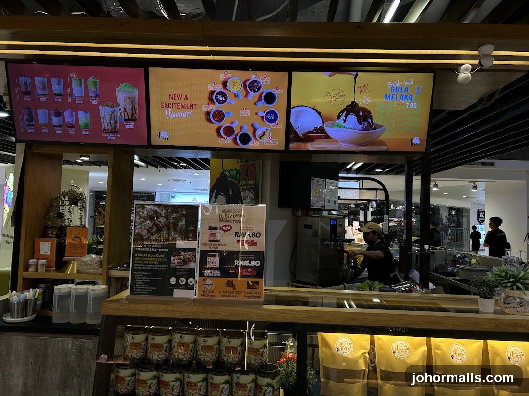 Dessert shop counter with digital menus and products