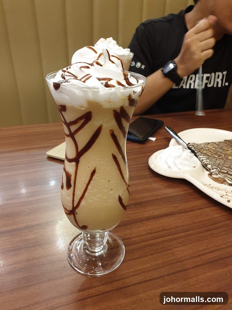 Iced Coffee with Whipped Cream and Chocolate Drizzle