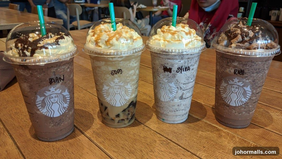 Four Frappuccinos on a Wooden Table