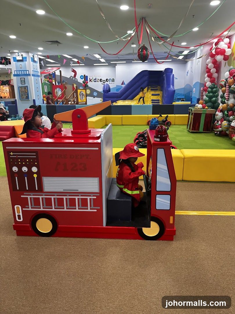 Children playing in a fire truck at a play center