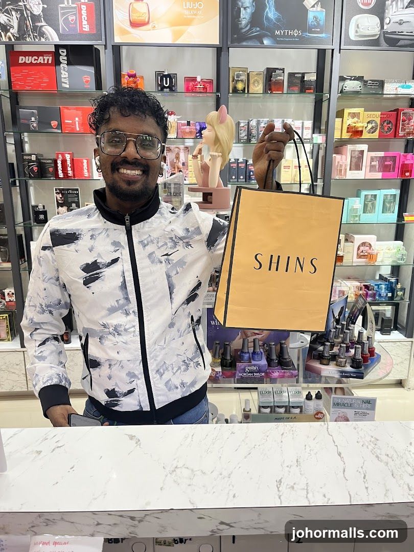 Man holding a shopping bag in a store
