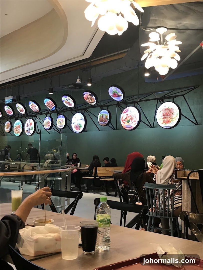 Food court interior with illuminated menu displays