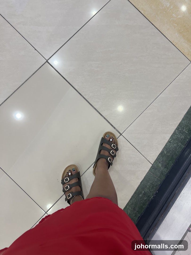 Feet in Sandals on Tiled Floor