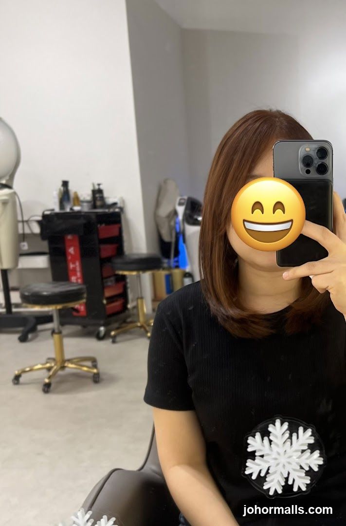 Woman taking a selfie in a salon