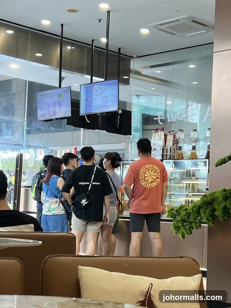 People ordering at a cafe