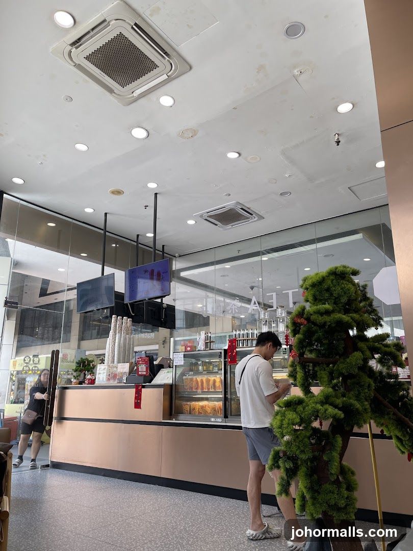 Interior of a cafe with a counter and customers