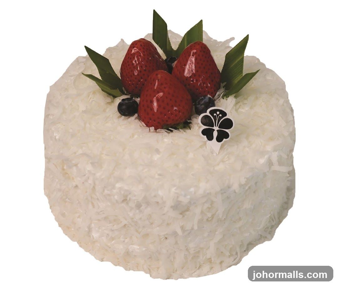 Coconut Cake with Strawberries and Blueberries
