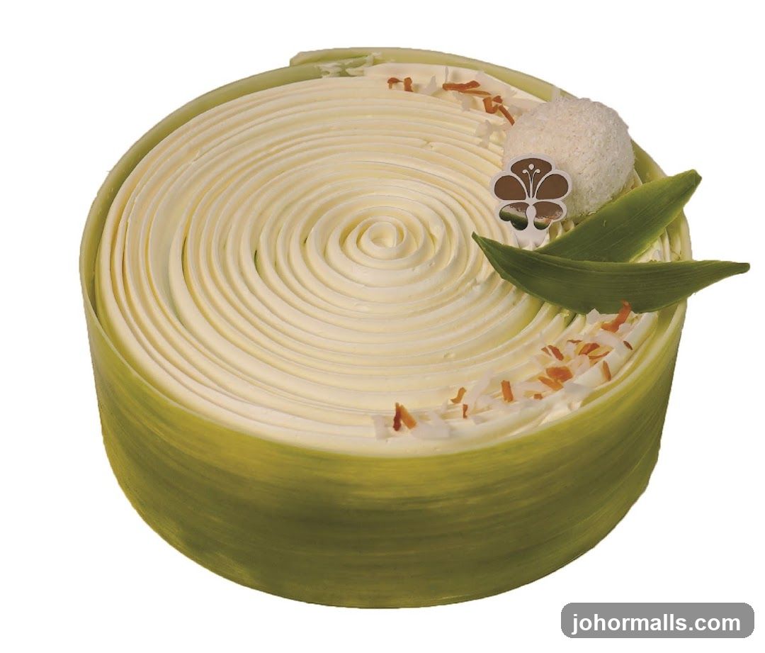 Round Cake with White Frosting and Green Wrapper