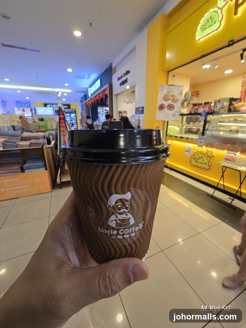 Coffee Cup in Front of Bakery