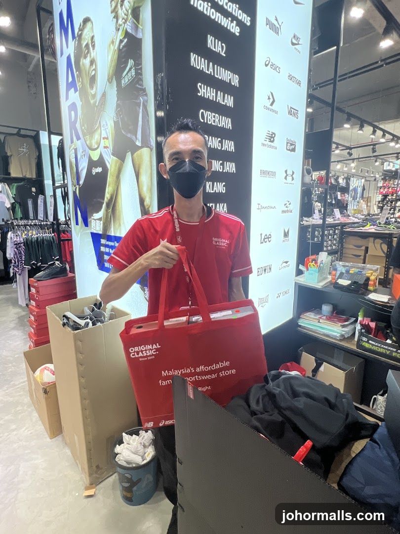 Store Employee with Branded Bag