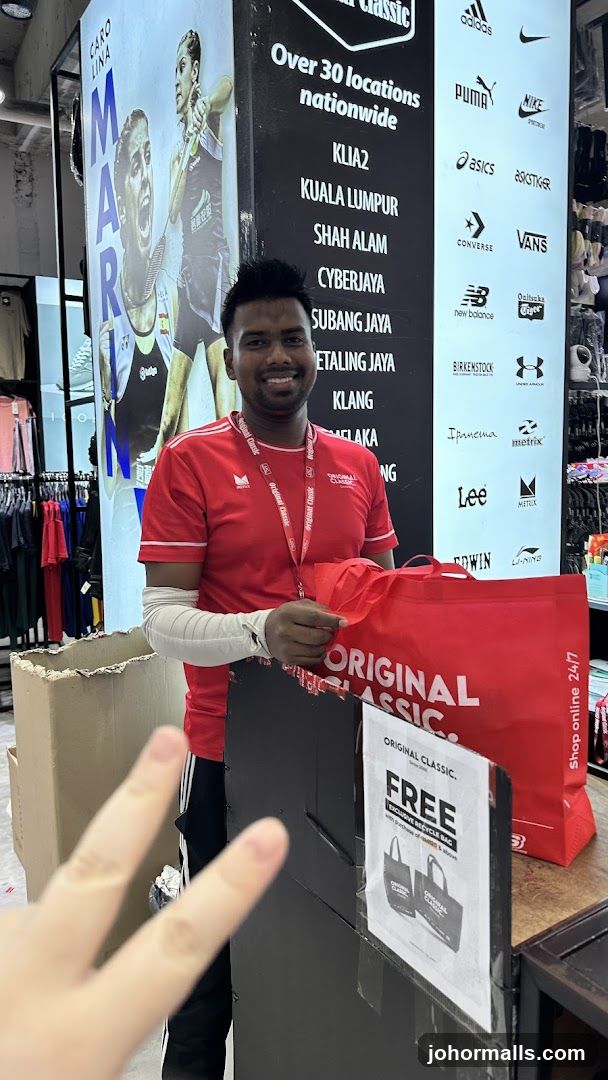 Store Employee with Shopping Bags