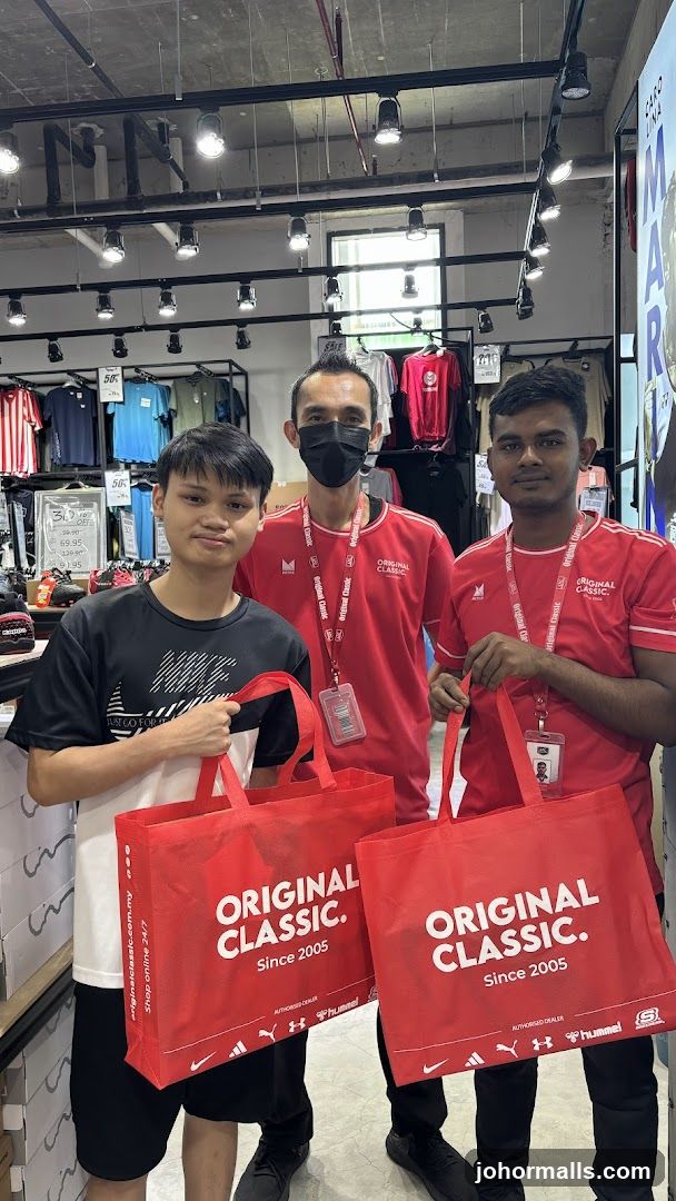 Store Employees with Branded Bags