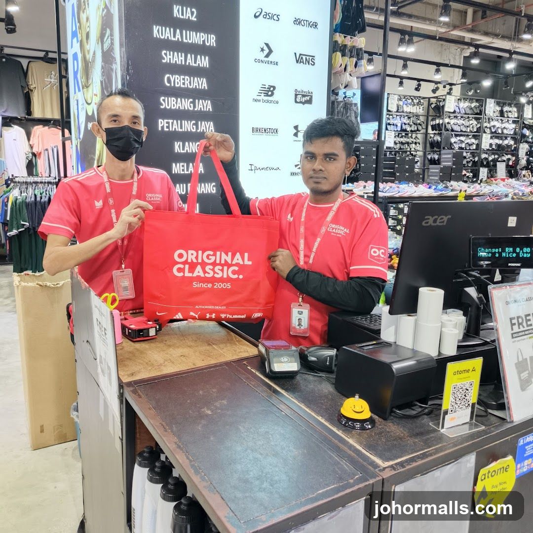 Store Employees Holding a Branded Tote Bag
