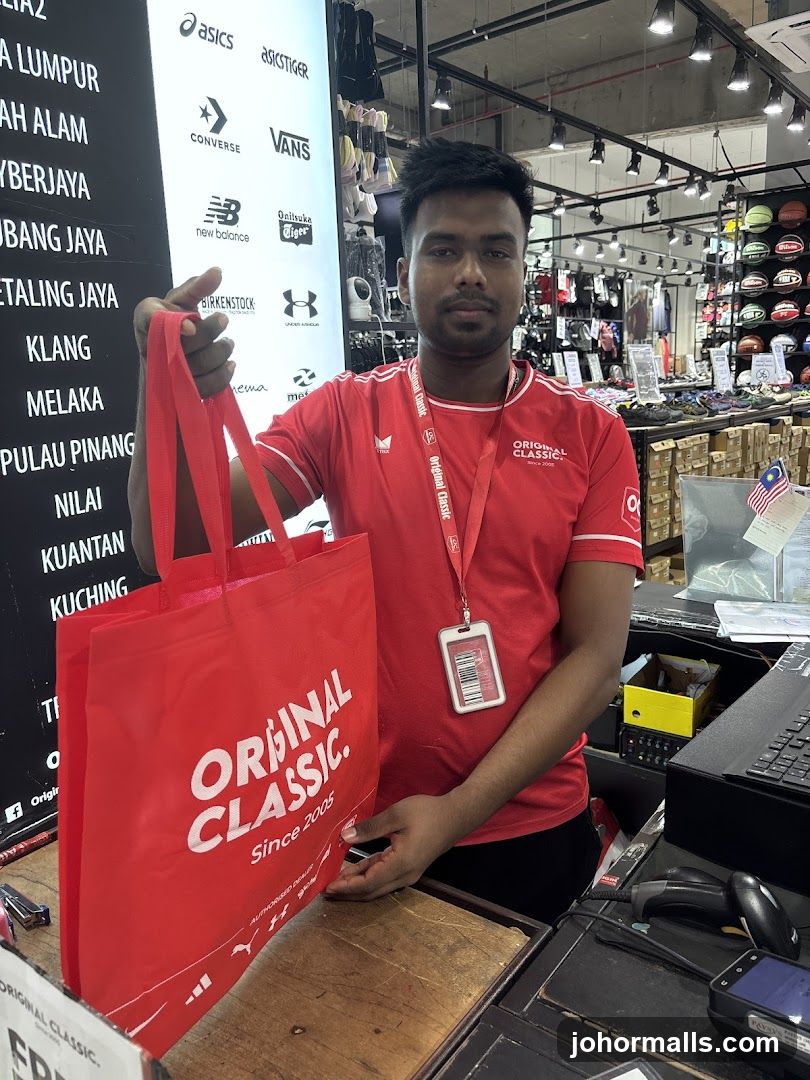 Store Employee with Branded Bag