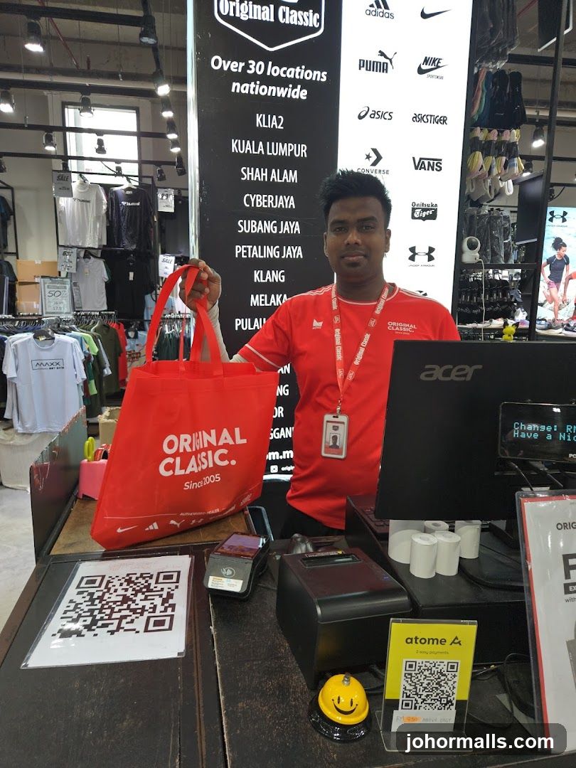 Store employee with shopping bag