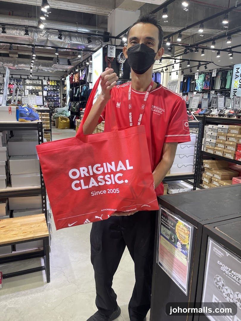 Man Holding a Branded Shopping Bag