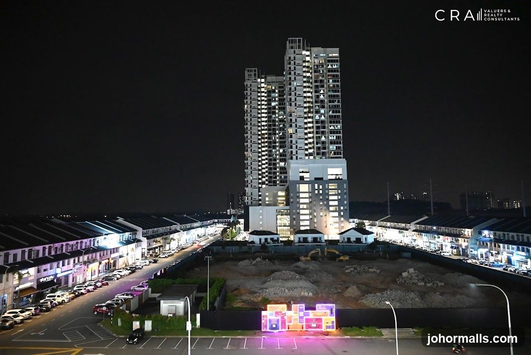 Night view of a city street with a tall building