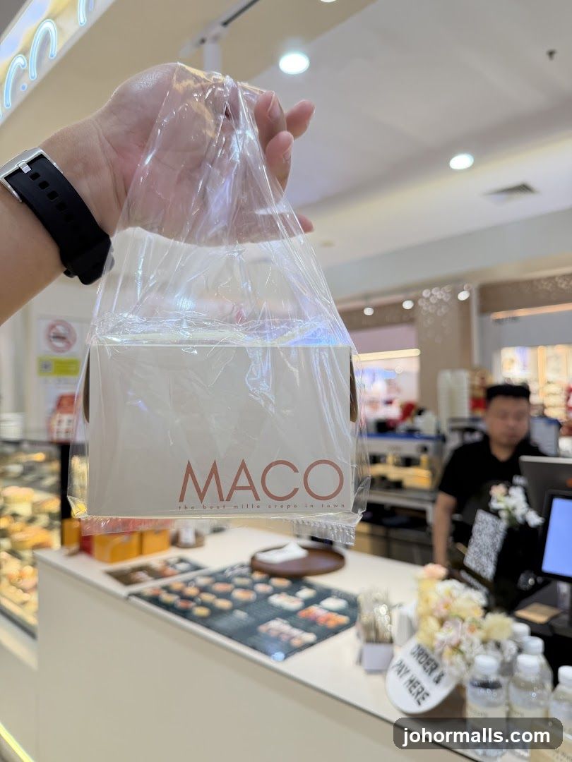 Person holding a bag with a logo