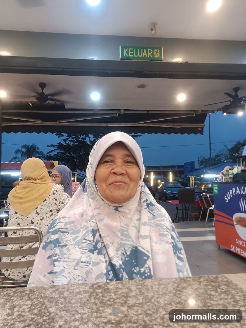 Woman in a hijab at a table