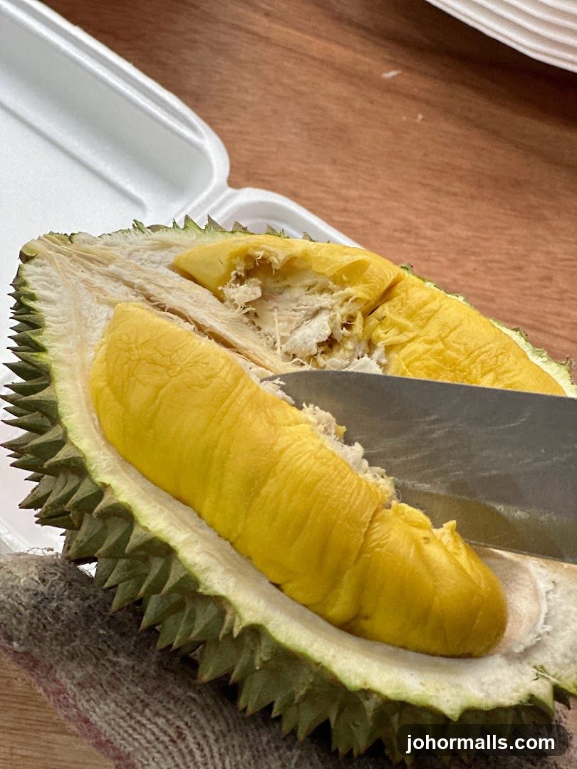 Durian Fruit Being Cut