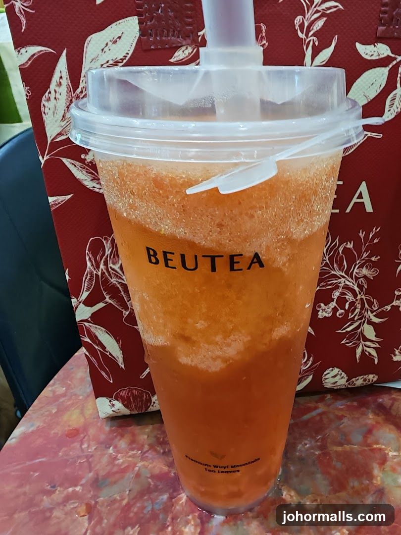 Orange Drink with BEUTEA Logo