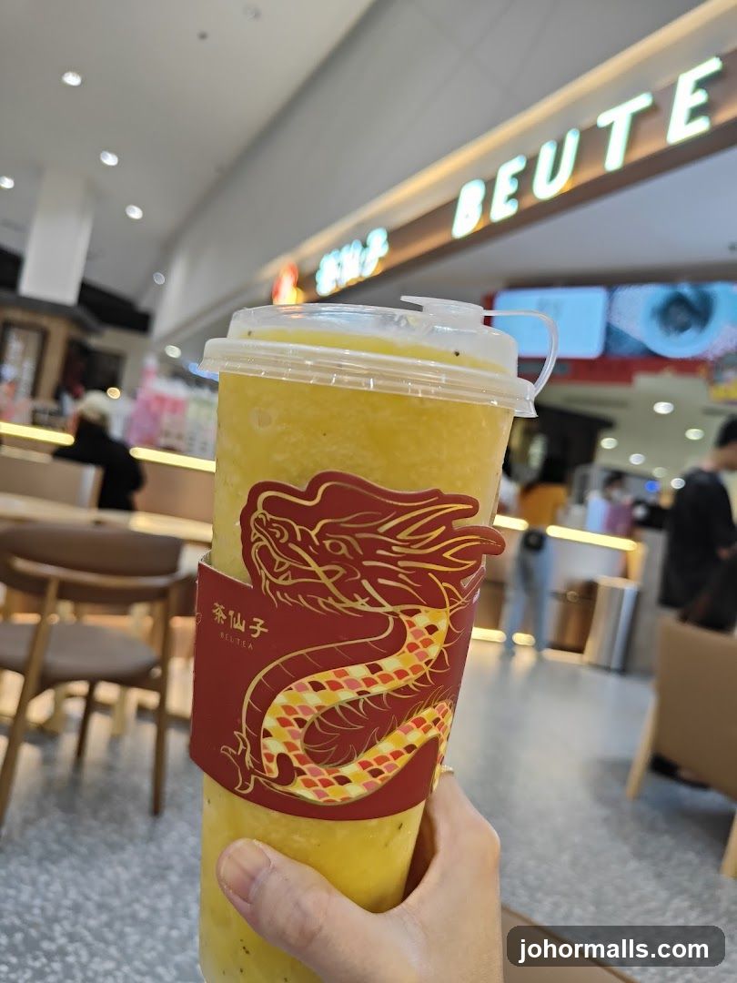 Dragon-themed cup sleeve on a yellow beverage