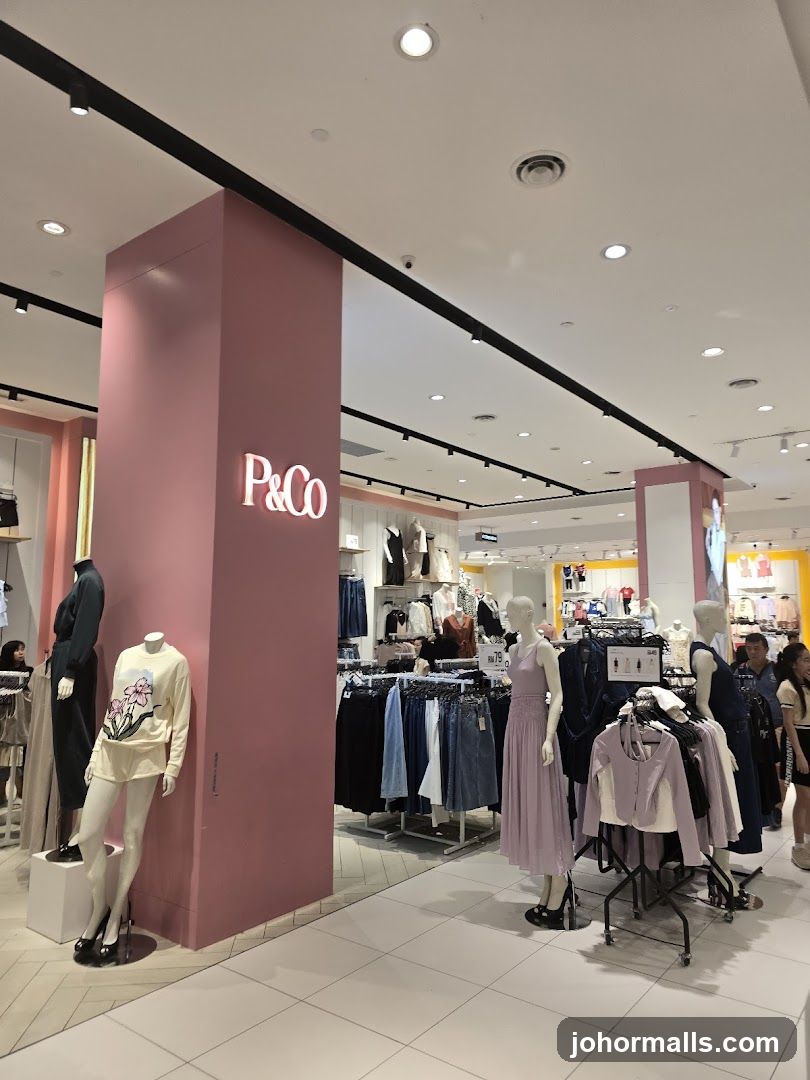 Clothing store interior with mannequins and apparel