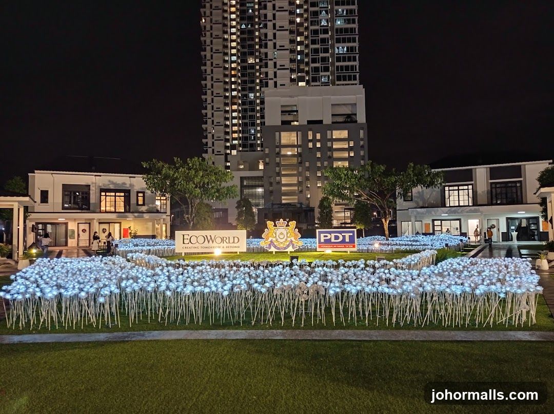 Nighttime display with illuminated flowers and signage